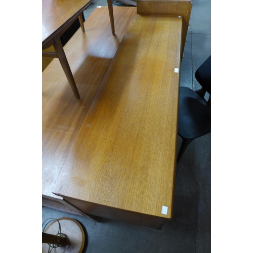 74 - A teak desk and a chair