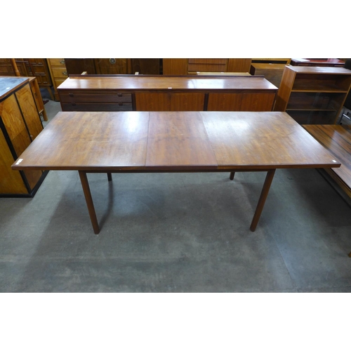 79 - An Archie Shine teak extending dining table, designed by Robert Heritage