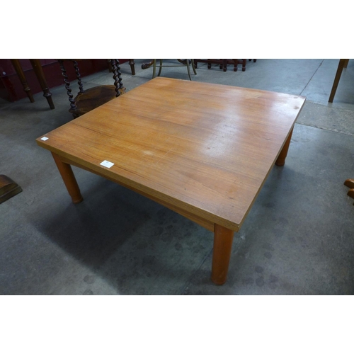 85 - A teak square coffee table