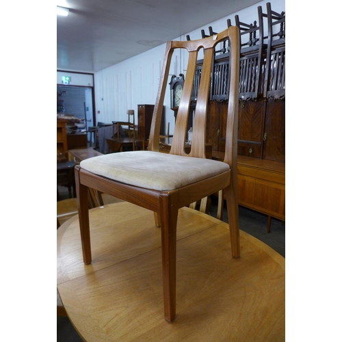 94 - A Nathan teak extending dining table and four chairs