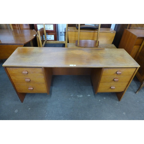 97 - A Stag Cantata teak desk, designed by Rob Carter