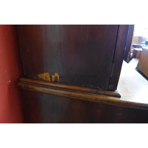 32 - A Victorian mahogany bookcase, bearing later Dunn & Co. Hat Makers, London inscription to doors