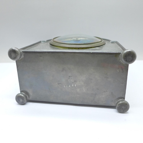 48a - A Liberty & Co. Arts and Crafts Tudric Pewter mantel timepiece, with turquoise enamelled dial, the m... 