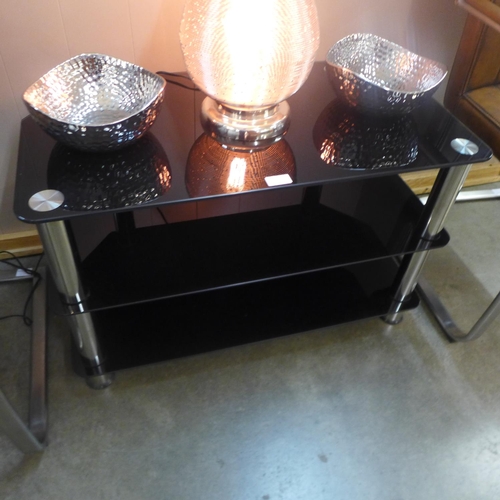 1347 - A black glass three tier TV/display stand (slight marks)