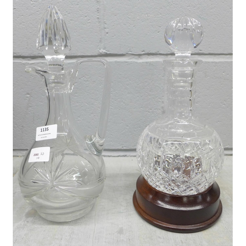 1135 - Two cut glass decanters, one with wooden stand **PLEASE NOTE THIS LOT IS NOT ELIGIBLE FOR POSTING AN... 