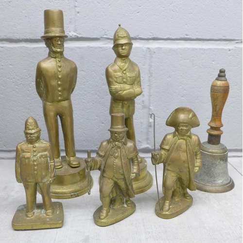 1138 - A brass hand bell and five solid brass figures, Abraham Lincoln, three policemen and one other **PLE... 