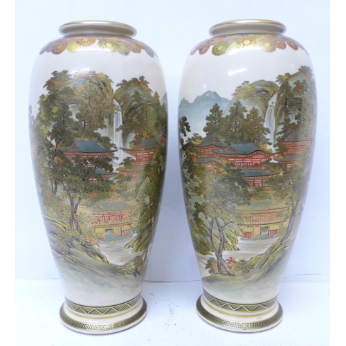 601 - A pair of meiji period Satsuma vases, 31cm