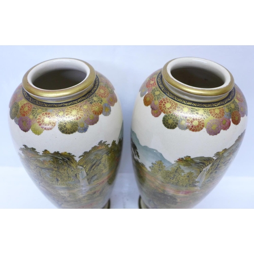 601 - A pair of meiji period Satsuma vases, 31cm