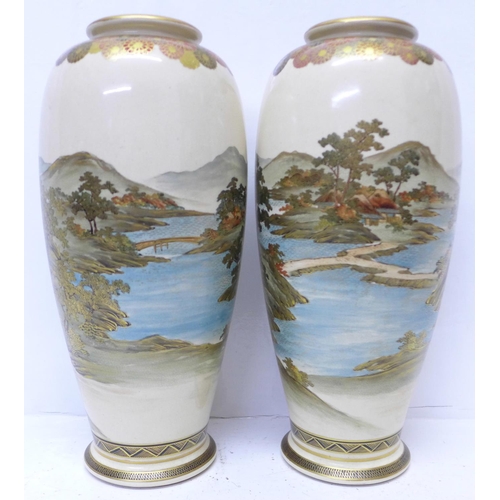 601 - A pair of meiji period Satsuma vases, 31cm