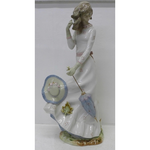 613 - A Zaphir Spanish figure of a girl with parasol, 41cm