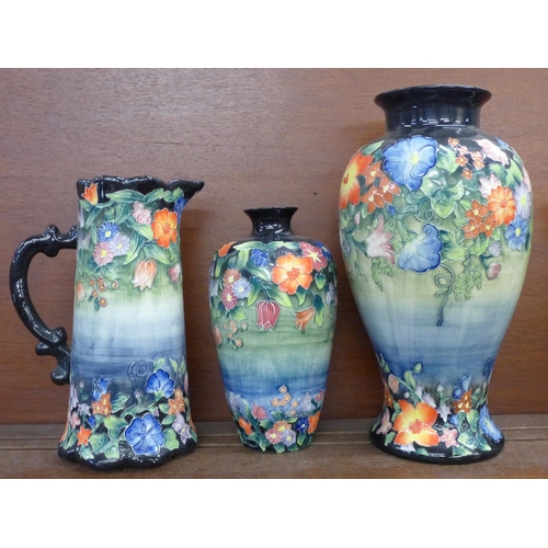 615 - Two Old Tupton ware tube lined vases and a pitcher