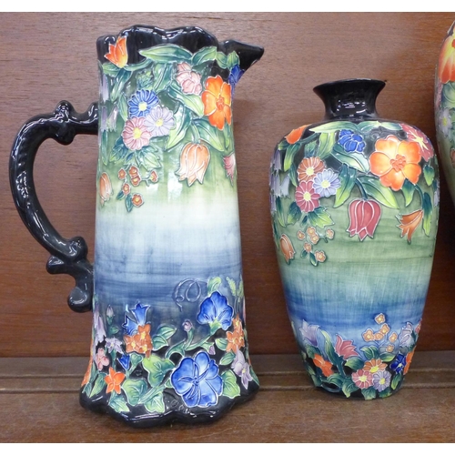 615 - Two Old Tupton ware tube lined vases and a pitcher