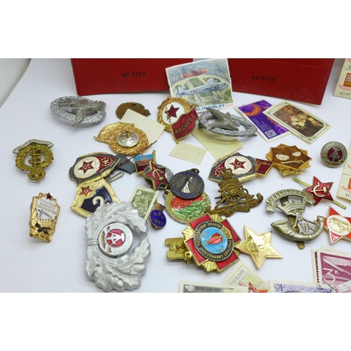 629 - Russian badges and two ID booklets, etc.