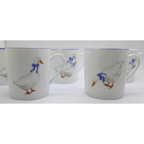 649 - Seven Limoges coffee cups, decorated with ducks