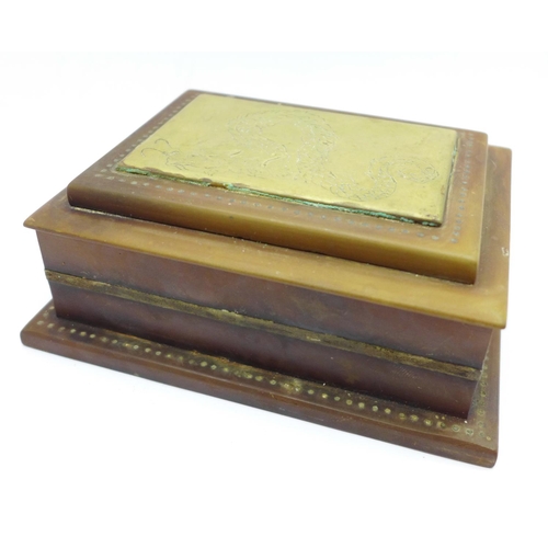 659 - A small horn box with brass dragon lid