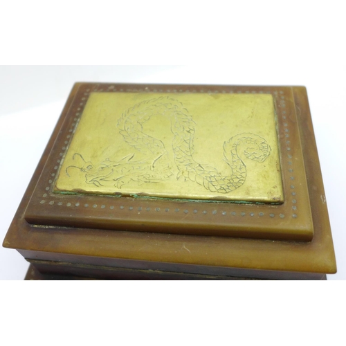 659 - A small horn box with brass dragon lid