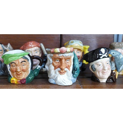 667 - Twelve small Royal Doulton character mugs