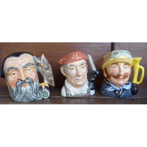 667 - Twelve small Royal Doulton character mugs