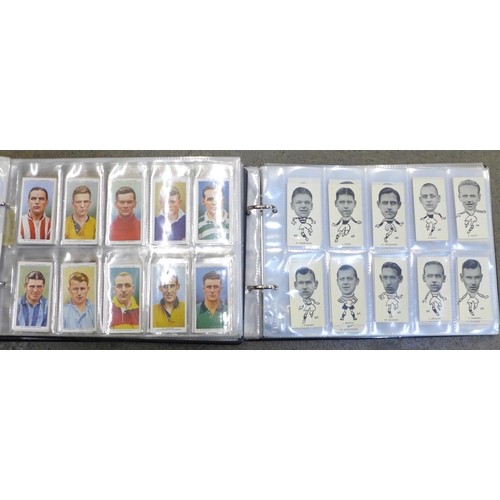 693 - Two albums of football related cigarette cards