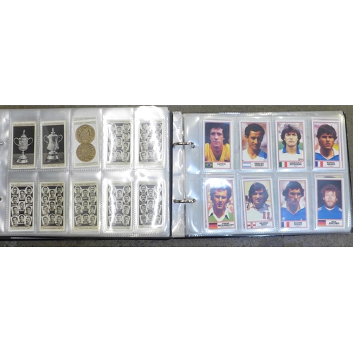 693 - Two albums of football related cigarette cards