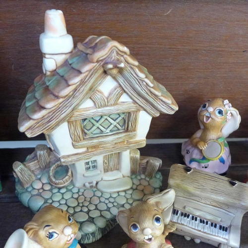 696 - A collection of Pendelfin rabbits and house