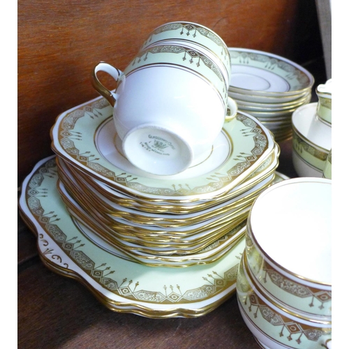 697 - A Gladstone china tea set comprising two cake plates, a sugar bowl, one milk jug, twelve small plate... 