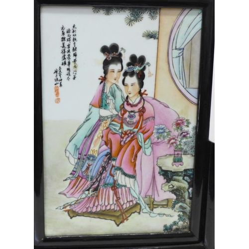 704 - A Japanese hand painted porcelain plaque on a lacquered stand