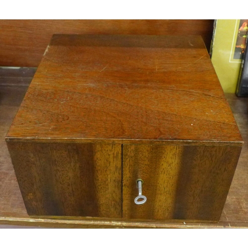 707 - A teak fourteen drawer coin cabinet, with key