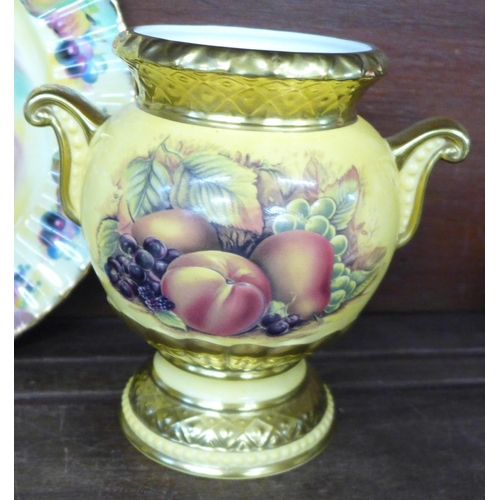 717 - A pair of Aynsley Orchard Gold vases with twist gilt handles, matching basket, a limited edition Bal... 