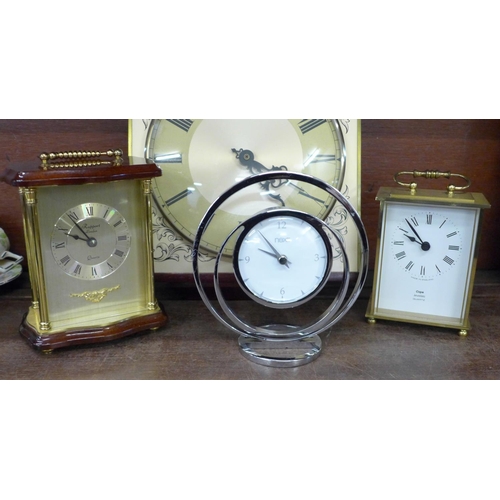 725 - A wall clock and three mantel clocks