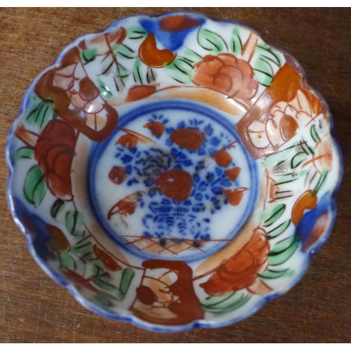 730 - A collection of Japanese Imari bowls and dishes