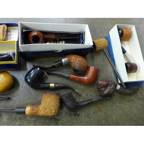 741 - Thirteen pipes including Parker of London and a box of ten lighters including Zippo