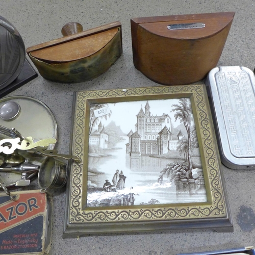 764 - A box of assorted items, framed 19th Century tile, blotter, etc.