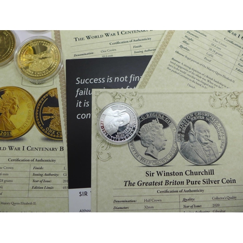 683 - Coins including a Sir Winston Churchill silver coin, three coin folders, partially complete and a ti... 