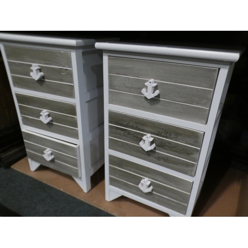 3025 - A pair of white painted three drawer bedside chests * this lot is subject to VAT