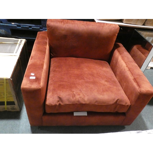 3030 - A rust velvet large armchair * this lot is subject to VAT