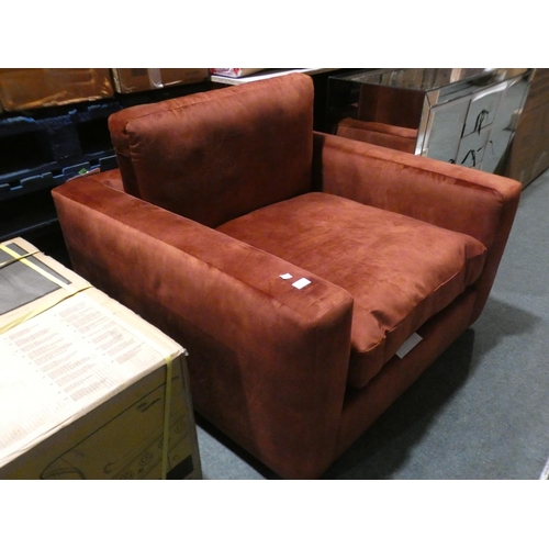 3030 - A rust velvet large armchair * this lot is subject to VAT