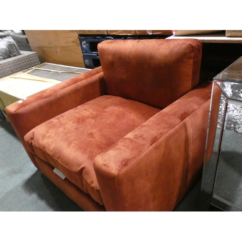 3030 - A rust velvet large armchair * this lot is subject to VAT