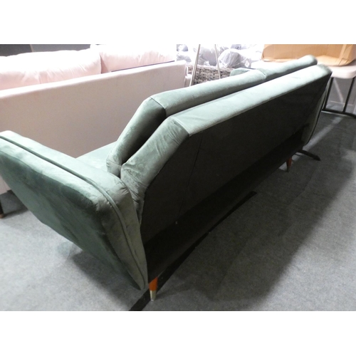 3070 - A green velvet three seater sofa with adjustable, fold down back * this lot is subject to VAT