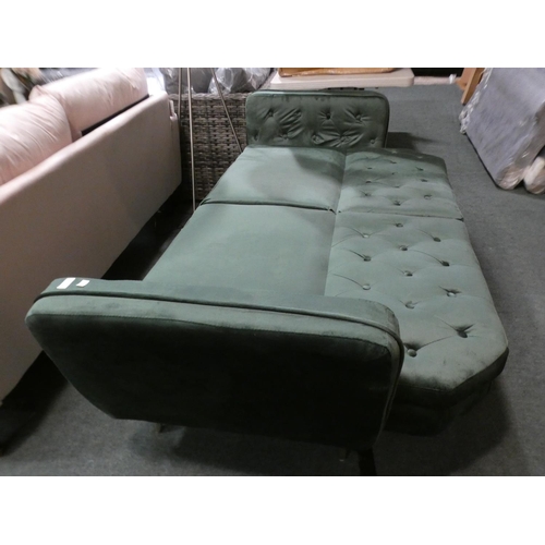 3070 - A green velvet three seater sofa with adjustable, fold down back * this lot is subject to VAT