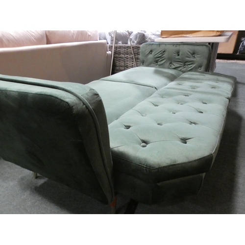 3070 - A green velvet three seater sofa with adjustable, fold down back * this lot is subject to VAT