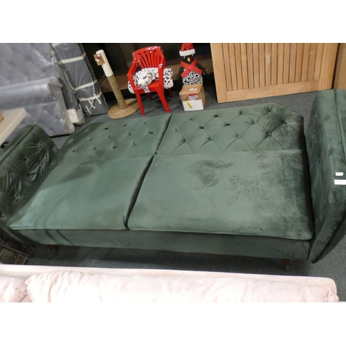 3070 - A green velvet three seater sofa with adjustable, fold down back * this lot is subject to VAT