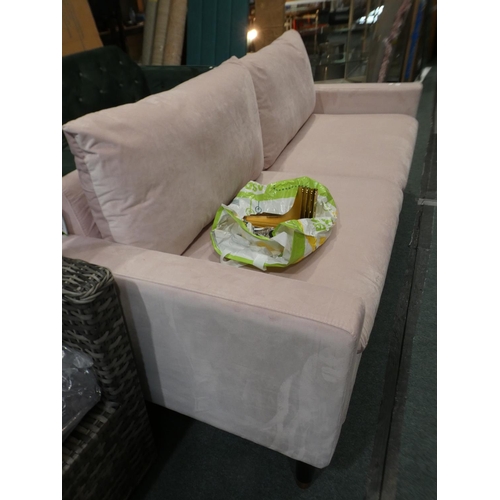 3071 - A blush pink velvet three seater sofa * this lot is subject to VAT