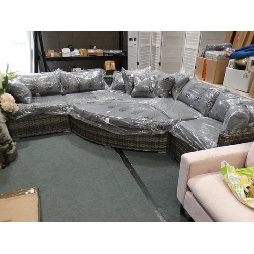 3073 - An all weather rattan large sectional corner sofa with footstool * this lot is subject to VAT