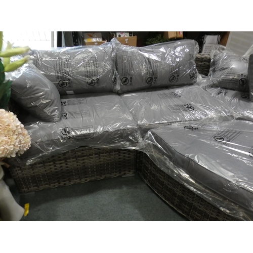 3073 - An all weather rattan large sectional corner sofa with footstool * this lot is subject to VAT