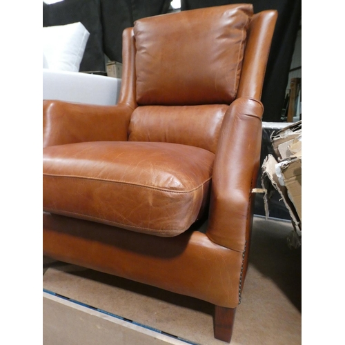 3077 - A Nubuck tan leather armchair * this lot is subject to VAT