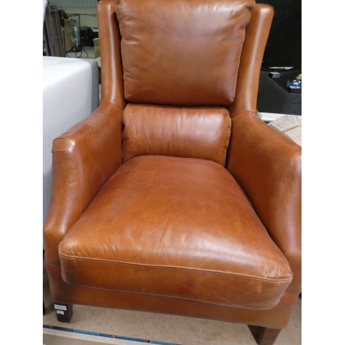 3077 - A Nubuck tan leather armchair * this lot is subject to VAT