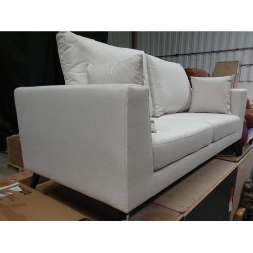 3078 - A cream fabric upholstered three seater sofa * this lot is subject to VAT