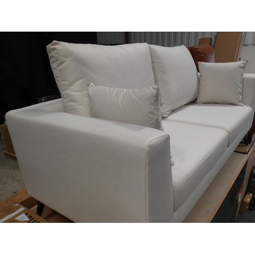 3078 - A cream fabric upholstered three seater sofa * this lot is subject to VAT