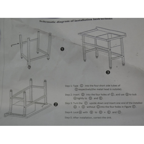 3090 - A stainless steel square tube foot basin * this lot is subject to VAT